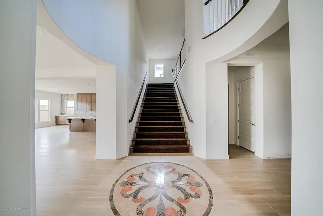 a kitchen with stainless steel appliances granite countertop a lot of counter space and wooden floor