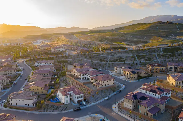 an aerial view of residential building and trees