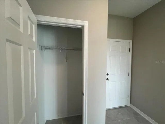 a large kitchen with stainless steel appliances kitchen island a large counter top