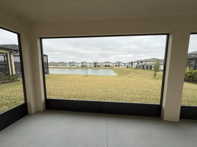 a view of an empty room with a large window