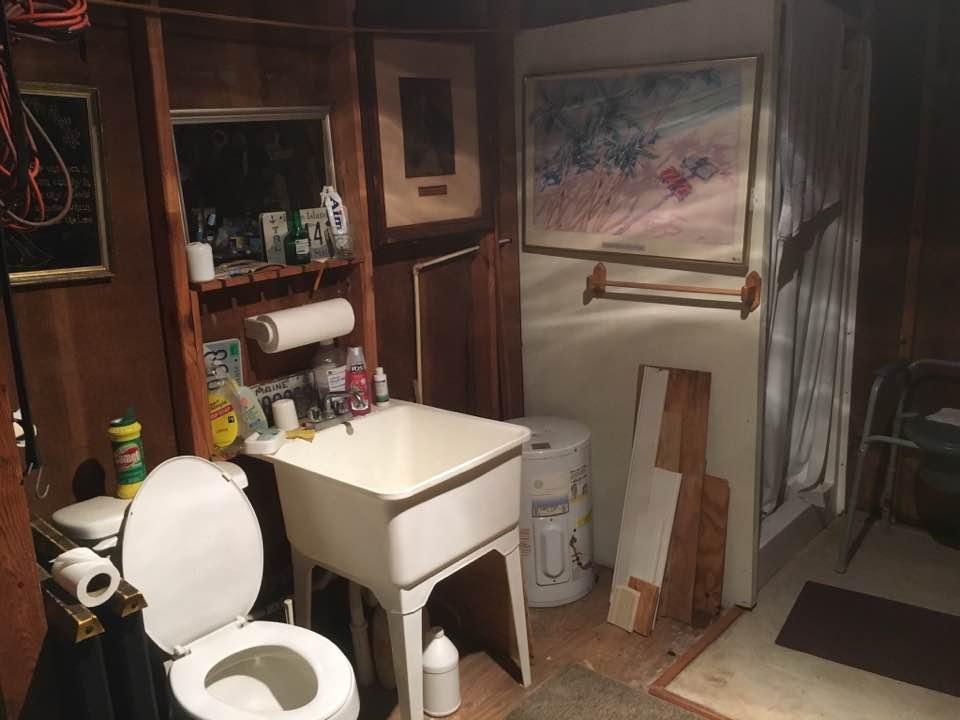 358 Squirrel Road DeFuniak Springs, FL 32433 - Photo 14 of 42 a bathroom with a toilet a sink and a mirror