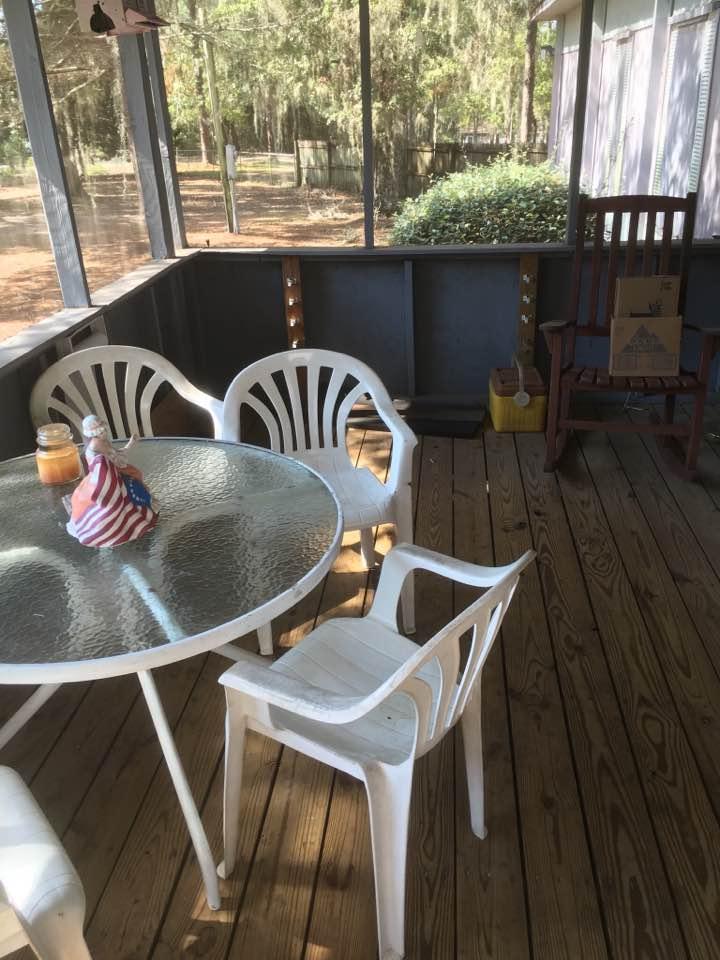 358 Squirrel Road DeFuniak Springs, FL 32433 - Photo 8 of 42 a roof deck with table and chairs