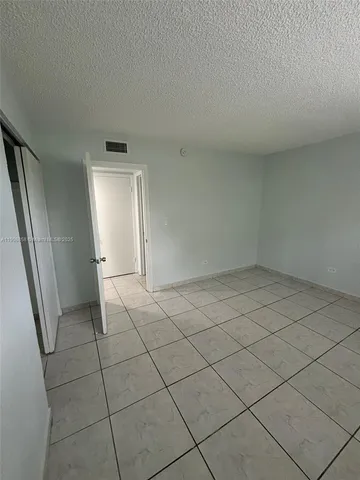 an empty room with a bathroom