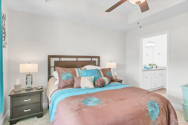 a bedroom with a bed and a dresser