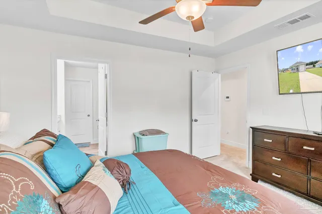 a bathroom with double vanity sinks granite tub shower and a mirror