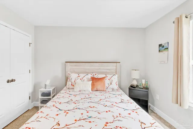 a bedroom with a bed and a closet