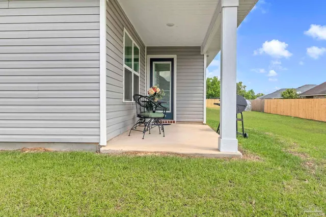 a bench sitting in front of a house