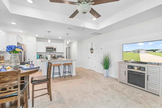 a view of a kitchen with a stove and cabinets