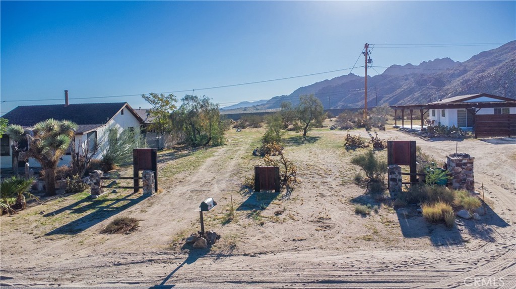 61981 Sunburst Circle Joshua Tree, CA 92252 - Photo 2 of 9 a view of a house with a yard