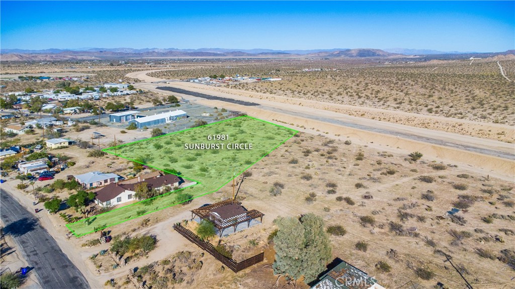 61981 Sunburst Circle Joshua Tree, CA 92252 - Photo 3 of 9 a view of an ocean beach and a mountain