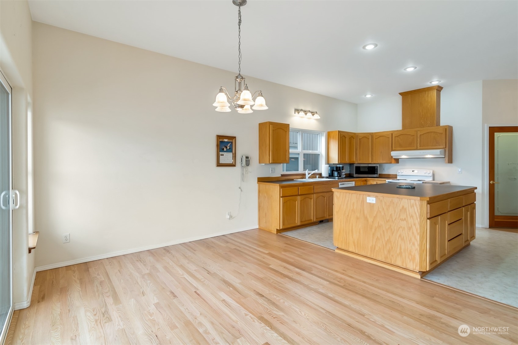 1811 Vernon Road Lake Stevens, WA 98258 - Photo 14 of 40 a kitchen with granite countertop a sink cabinets and stainless steel appliances
