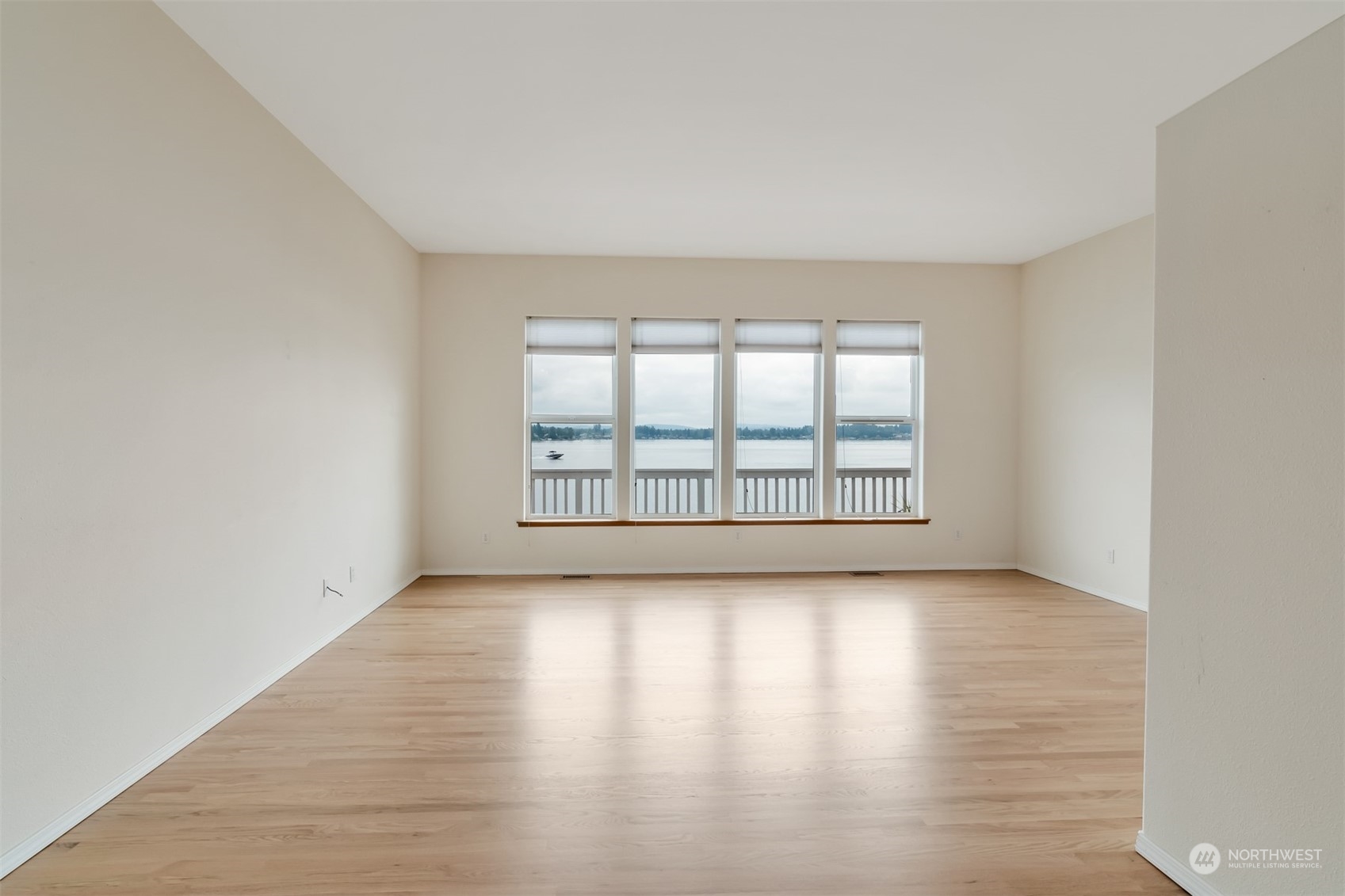 1811 Vernon Road Lake Stevens, WA 98258 - Photo 8 of 40 an empty room with wooden floor and windows