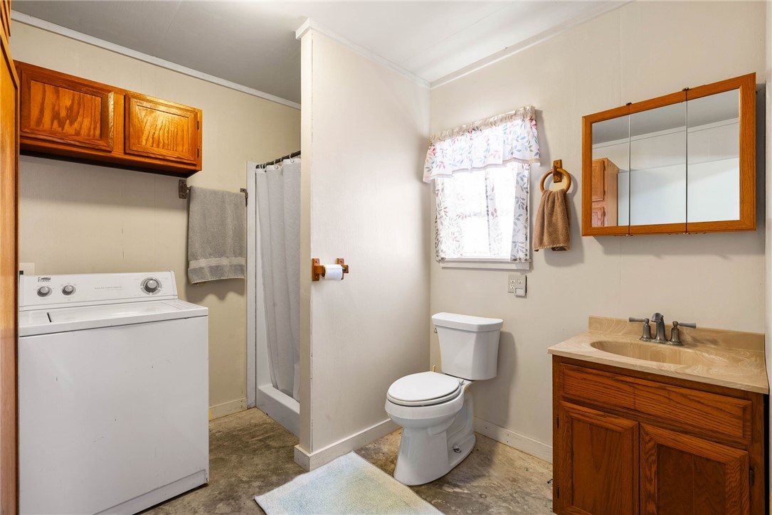 523 Ranger Drive Sandia, TX 78383 - Photo 8 of 21 a bathroom with a sink a toilet and a mirror