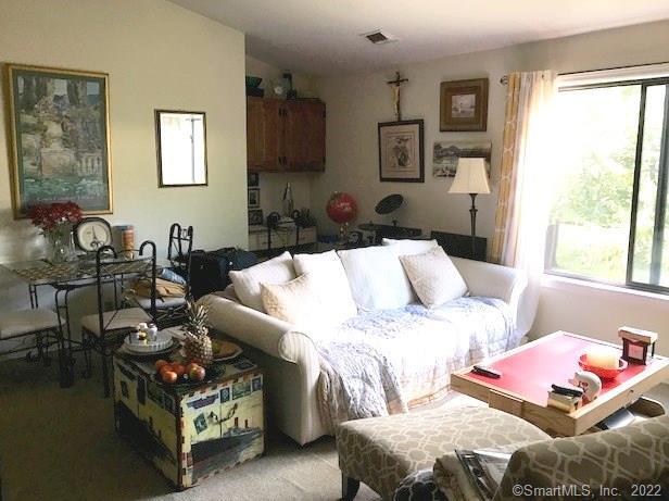 78 Olcott Way, Unit 78 Ridgefield, CT 06877 - Photo 1 of 1 a living room with furniture and a window