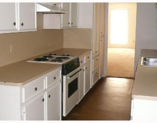5014 Wingfoot Lane Corpus Christi, TX 78413 - Photo 2 of 3 a kitchen with a stove and a refrigerator