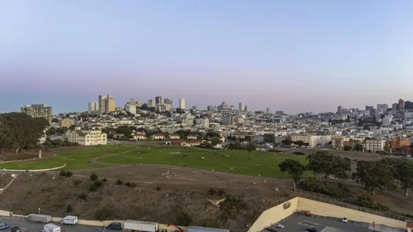 a view of a city with tall buildings in back