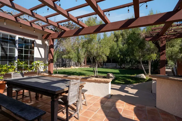 a view of yard with patio