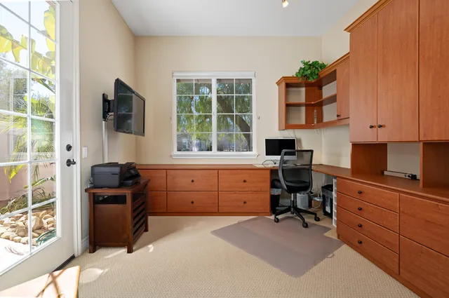 a kitchen with a stove a sink and a refrigerator
