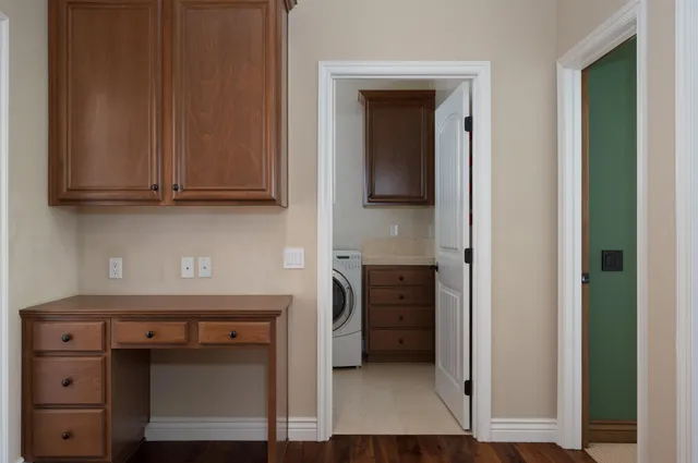 a view of cabinets and a wooden floor