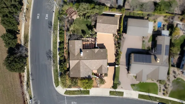 an aerial view of houses with outdoor space