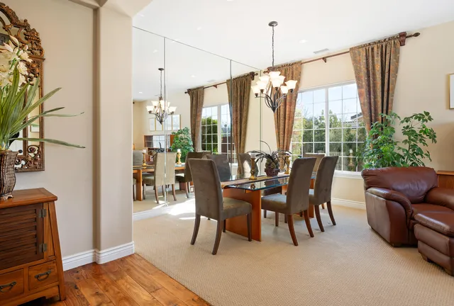 a view of a dining room with furniture window and outside view