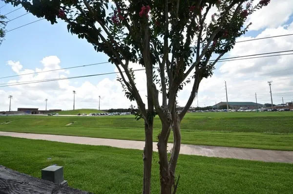 a view of a golf course with a big yard