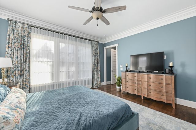 a spacious bathroom with a tub sink and mirror