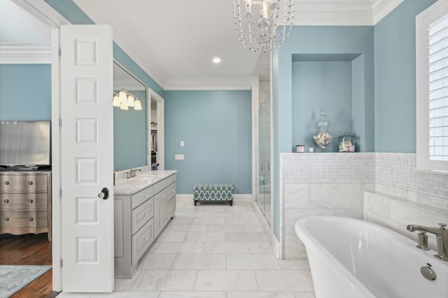 a bathroom with a bathtub and a shower