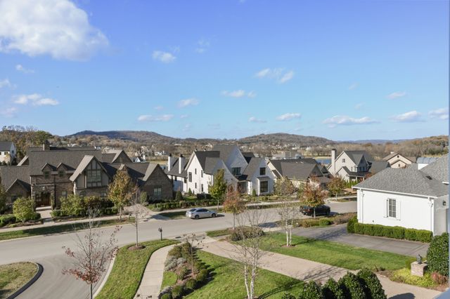 a view of a backyard with sitting area