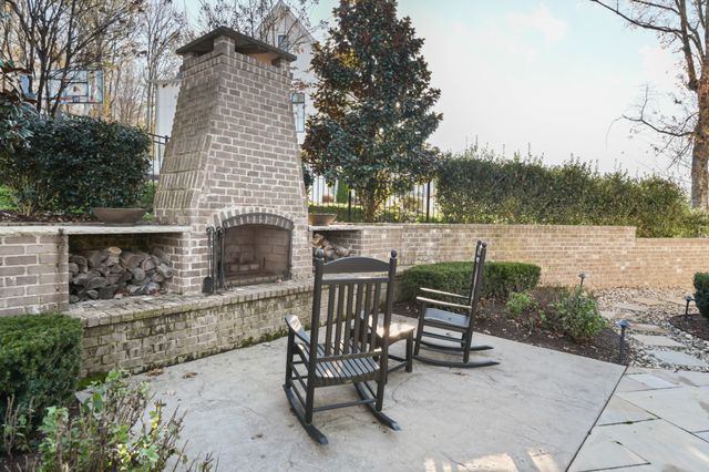 a view of a patio with two chairs and a table