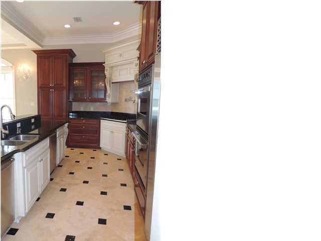 8708 Hwy Santa Rosa Beach, Unit B 30A Inlet Beach, FL 32461 - Photo 26 of 36 a kitchen with granite countertop a sink and a refrigerator