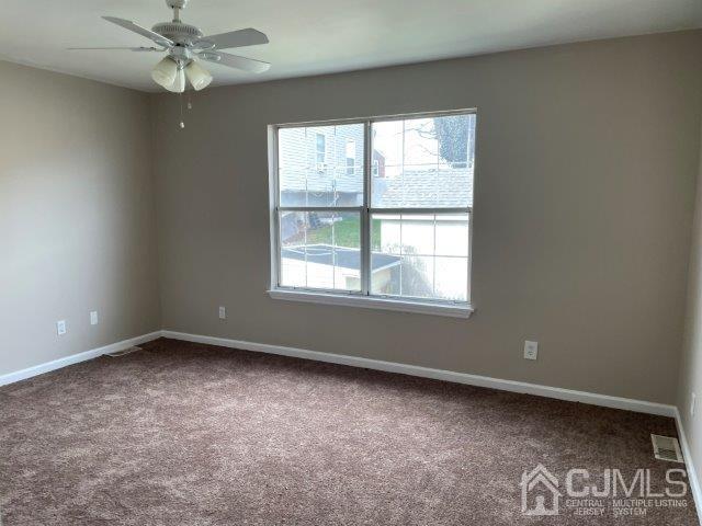 11 Florida Grove Road, Unit 5 Keasbey, NJ 08832 - Photo 4 of 12 an empty room with a window