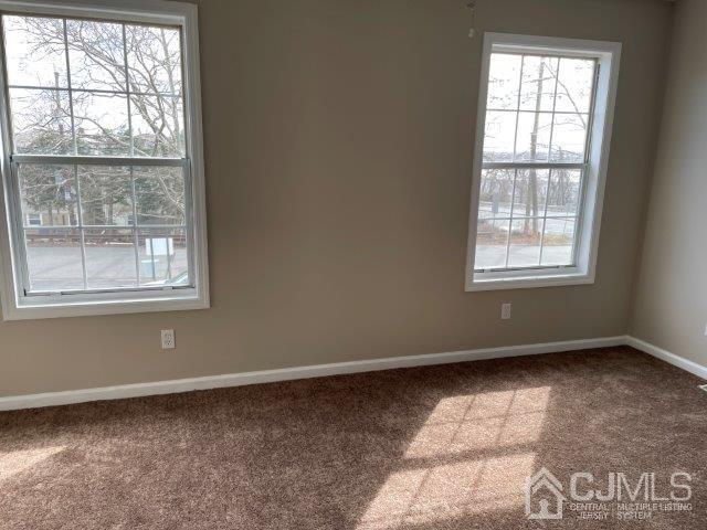11 Florida Grove Road, Unit 5 Keasbey, NJ 08832 - Photo 5 of 12 an empty room with a window