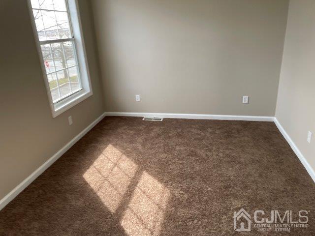 11 Florida Grove Road, Unit 5 Keasbey, NJ 08832 - Photo 6 of 12 an empty room with windows