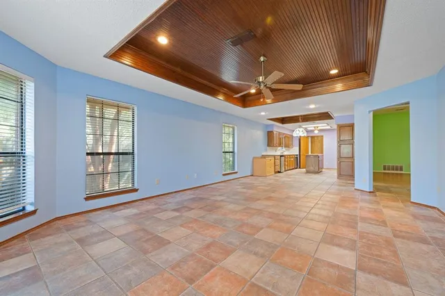 a kitchen with stainless steel appliances granite countertop a refrigerator a oven and a sink