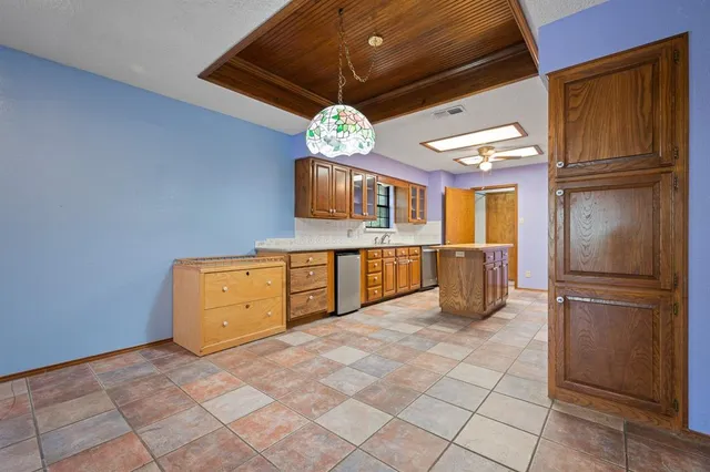 a view of a kitchen with furniture and a kitchen