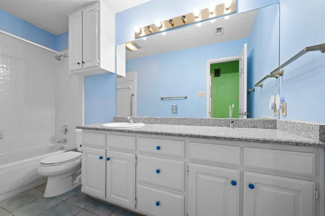 a view of a kitchen with a dishwasher cabinets and wooden floor