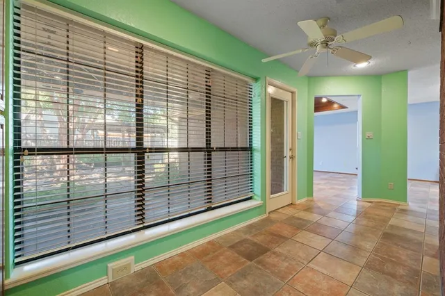 a view of a balcony with a ceiling fan