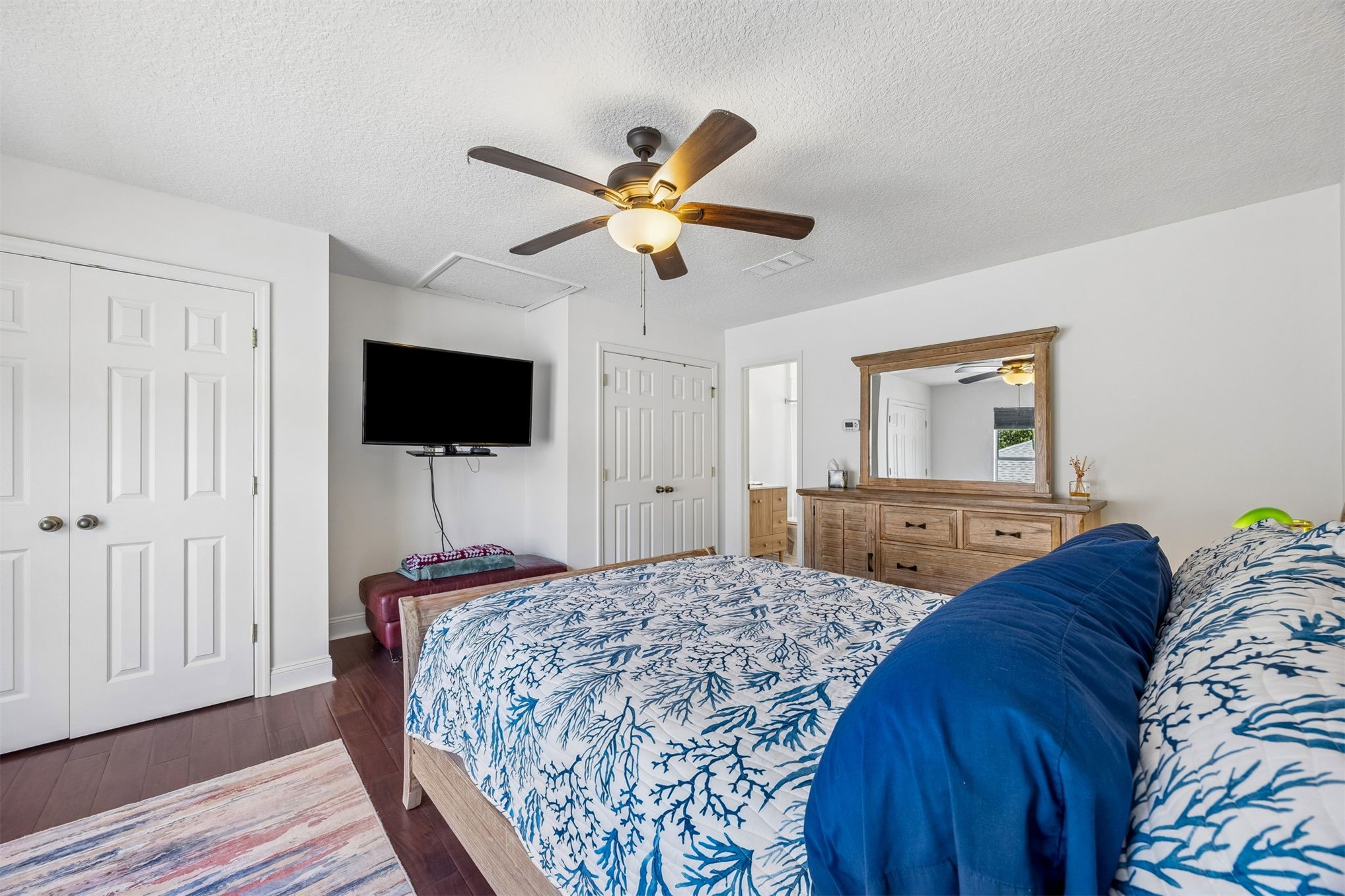 86107 Remsenburg Drive Fernandina Beach, FL 32034 - Photo 24 of 58 a bedroom with a bed and a flat screen tv