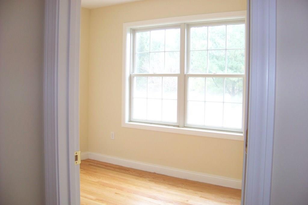 509 Main Street, Unit 4 Old Saybrook, CT 06475 - Photo 15 of 27 a view of an empty room with a window
