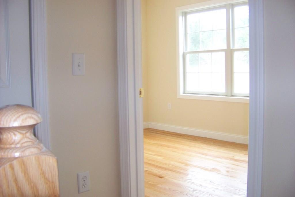 509 Main Street, Unit 4 Old Saybrook, CT 06475 - Photo 17 of 27 a view of an empty room with a window