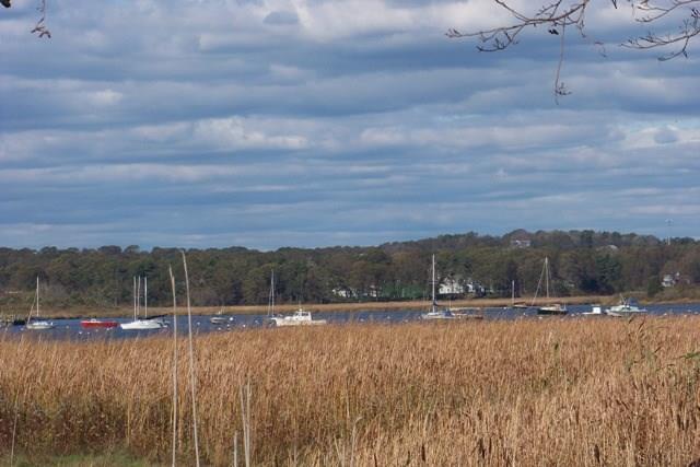 509 Main Street, Unit 4 Old Saybrook, CT 06475 - Photo 2 of 27 a view of a lake with mountains in the background
