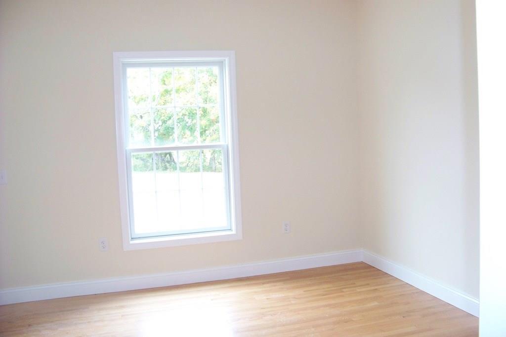 509 Main Street, Unit 4 Old Saybrook, CT 06475 - Photo 3 of 27 an empty room with a window