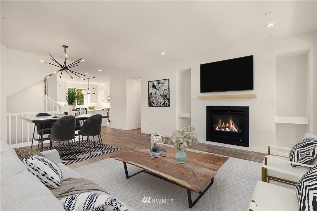 21711 25th (site 17) Street Southeast, Unit C Bothell, WA 98021 - Photo 5 of 10 a living room with furniture a flat screen tv and a fireplace