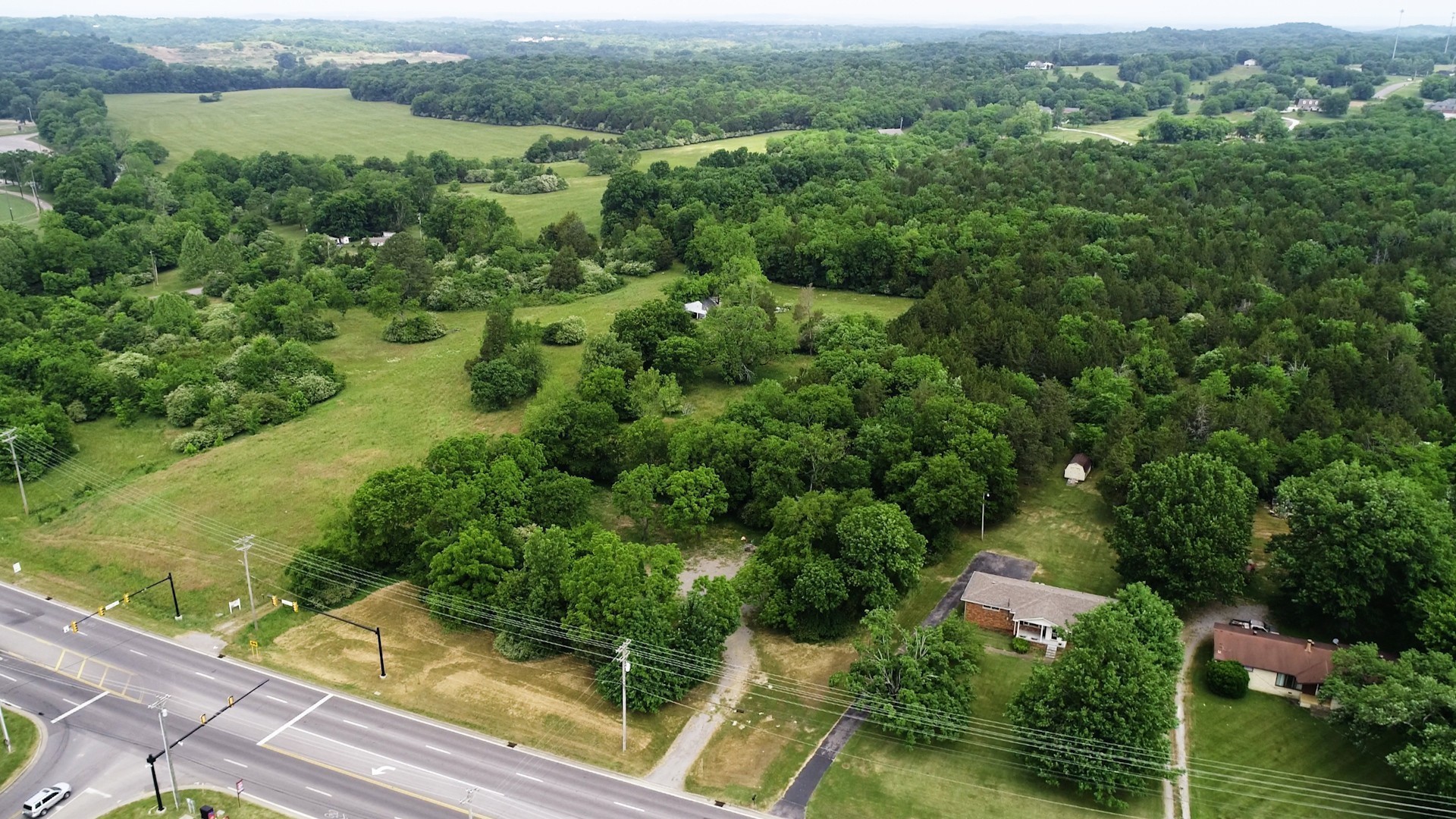 10615 Lebanon Road Mount Juliet, TN 37122 - Photo 1 of 18 an aerial view of residential houses with outdoor space and trees