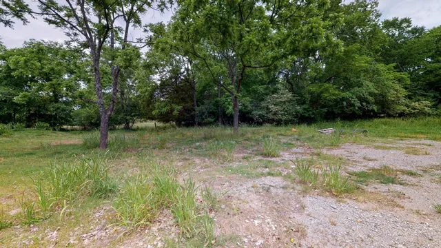 a view of outdoor space with deck and yard