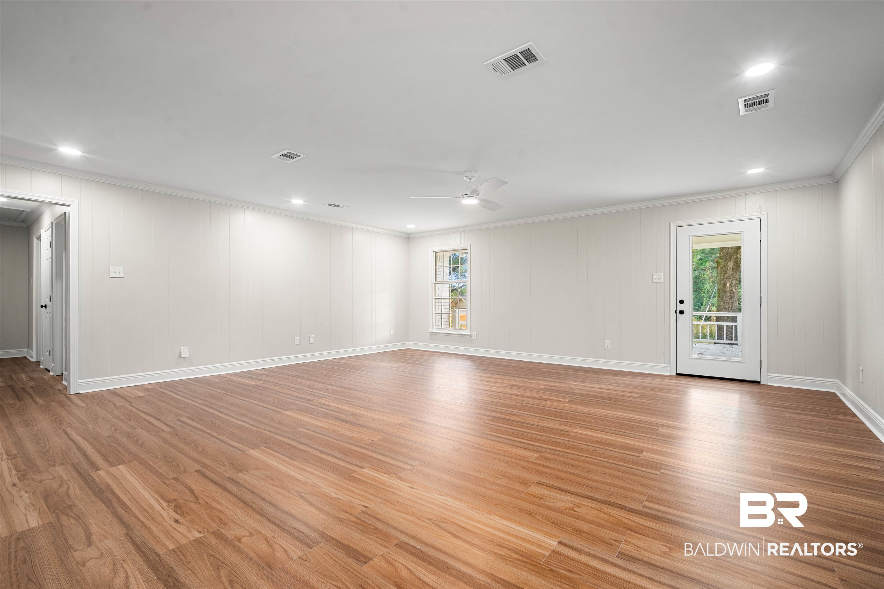 3050 Lacoste Road Mobile, AL 36618 - Photo 8 of 30 Spare room with recessed lighting, crown molding, plenty of natural light, light wood-type flooring, and a ceiling fan