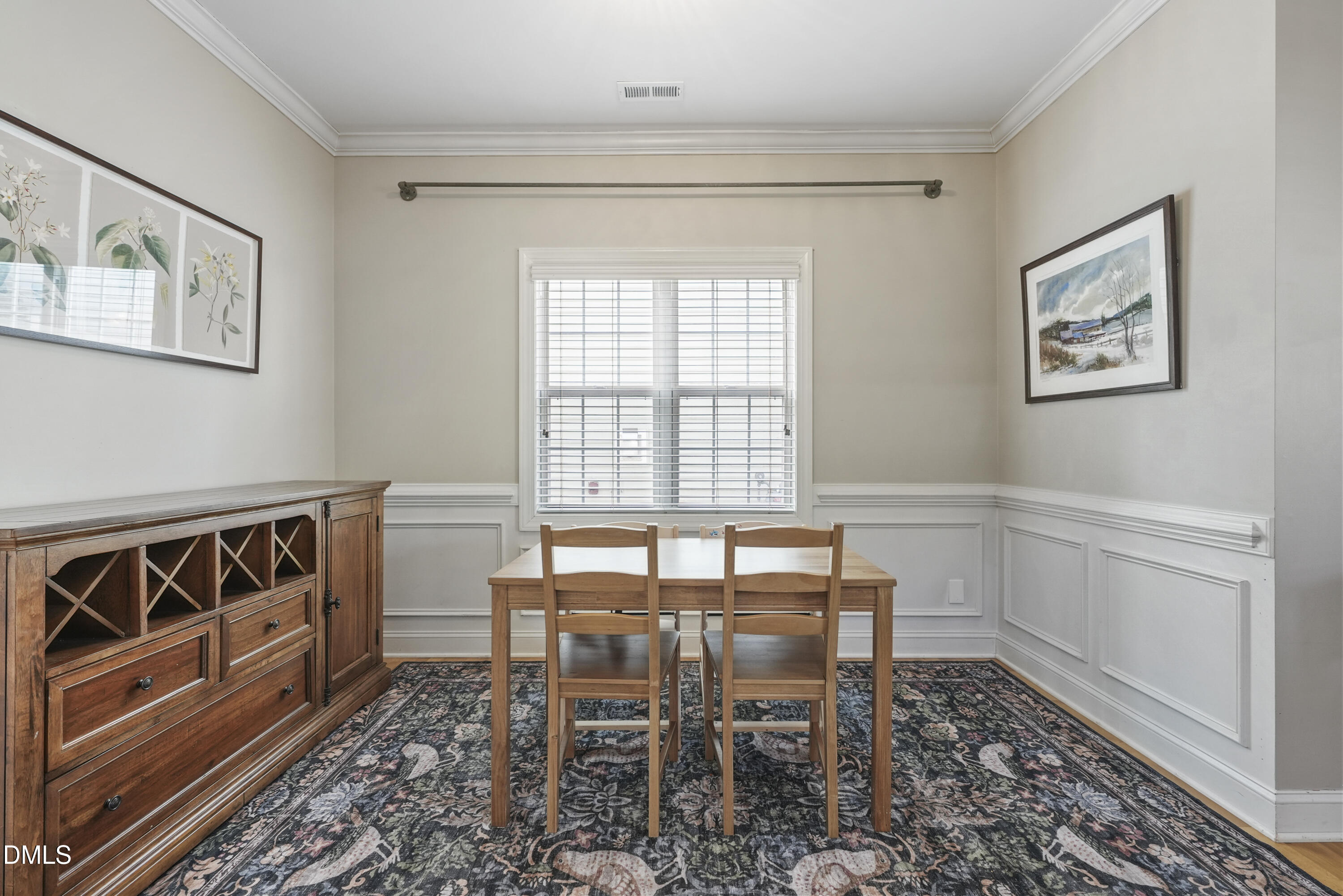4912 Morning Edge Drive Raleigh, NC 27613 - Photo 12 of 35 a view of a dining room with furniture window and wooden floor