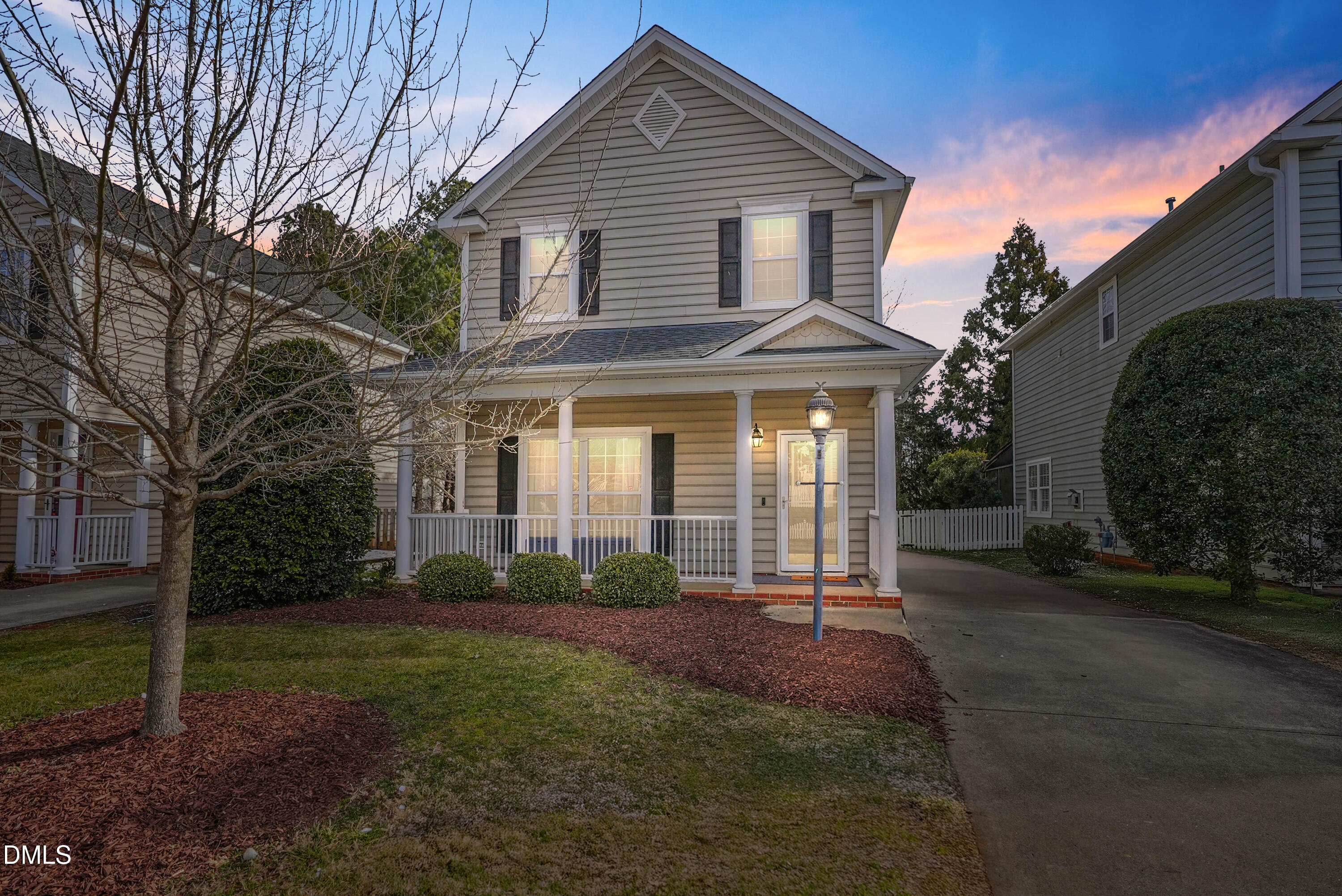 4912 Morning Edge Drive Raleigh, NC 27613 - Photo 2 of 35 a front view of a house with garden