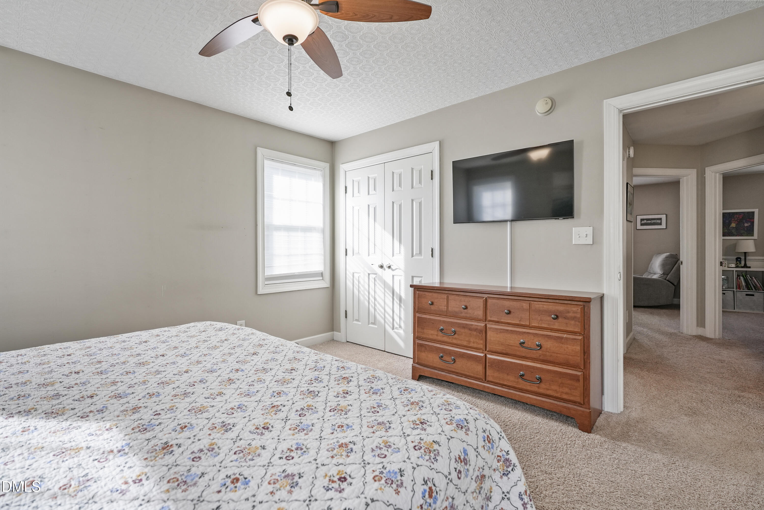 4912 Morning Edge Drive Raleigh, NC 27613 - Photo 25 of 35 a bedroom with a bed and a flat screen tv